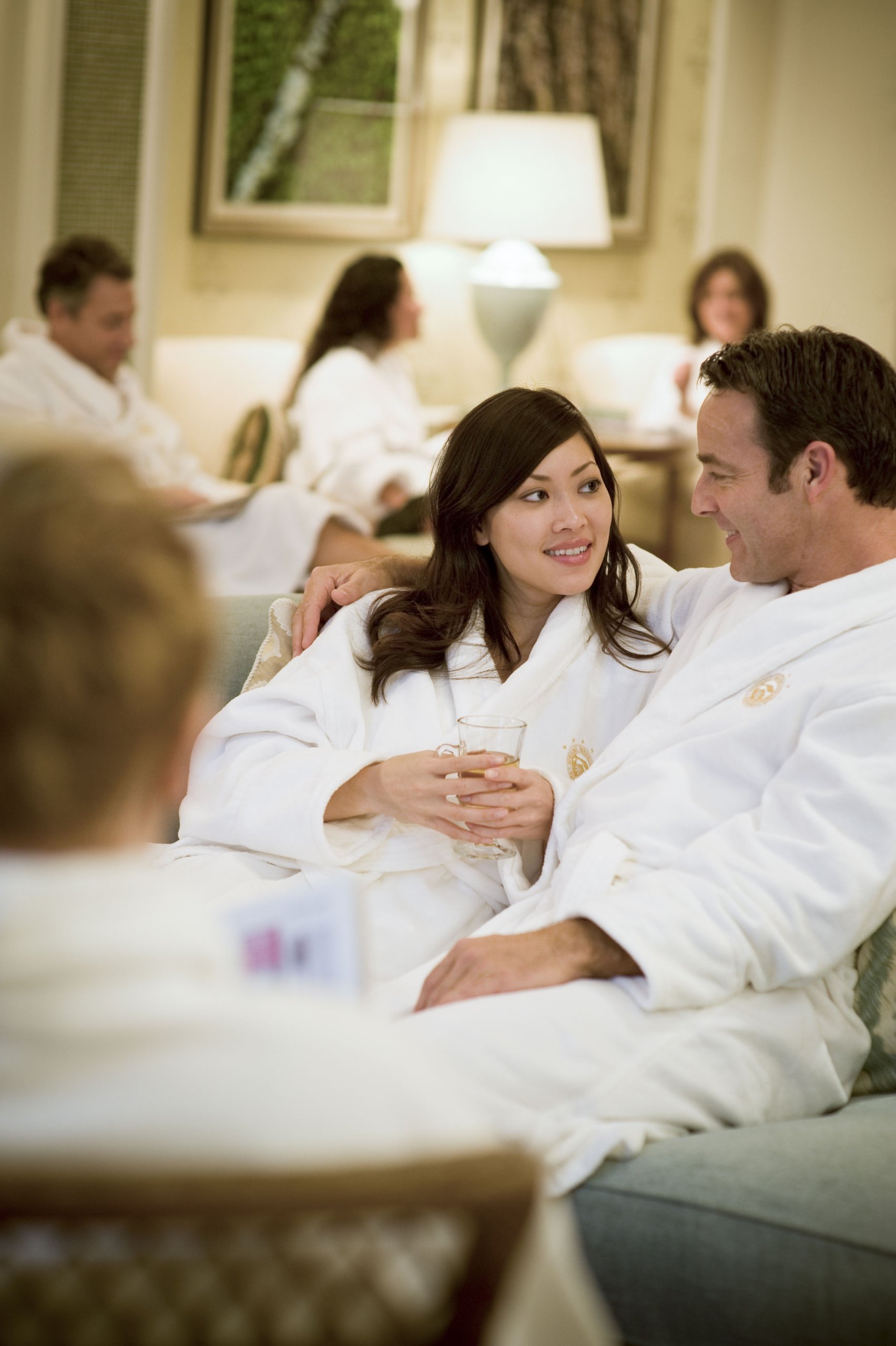 A man and woman relax in their bath robes at Mount Washington Resort and Spa.