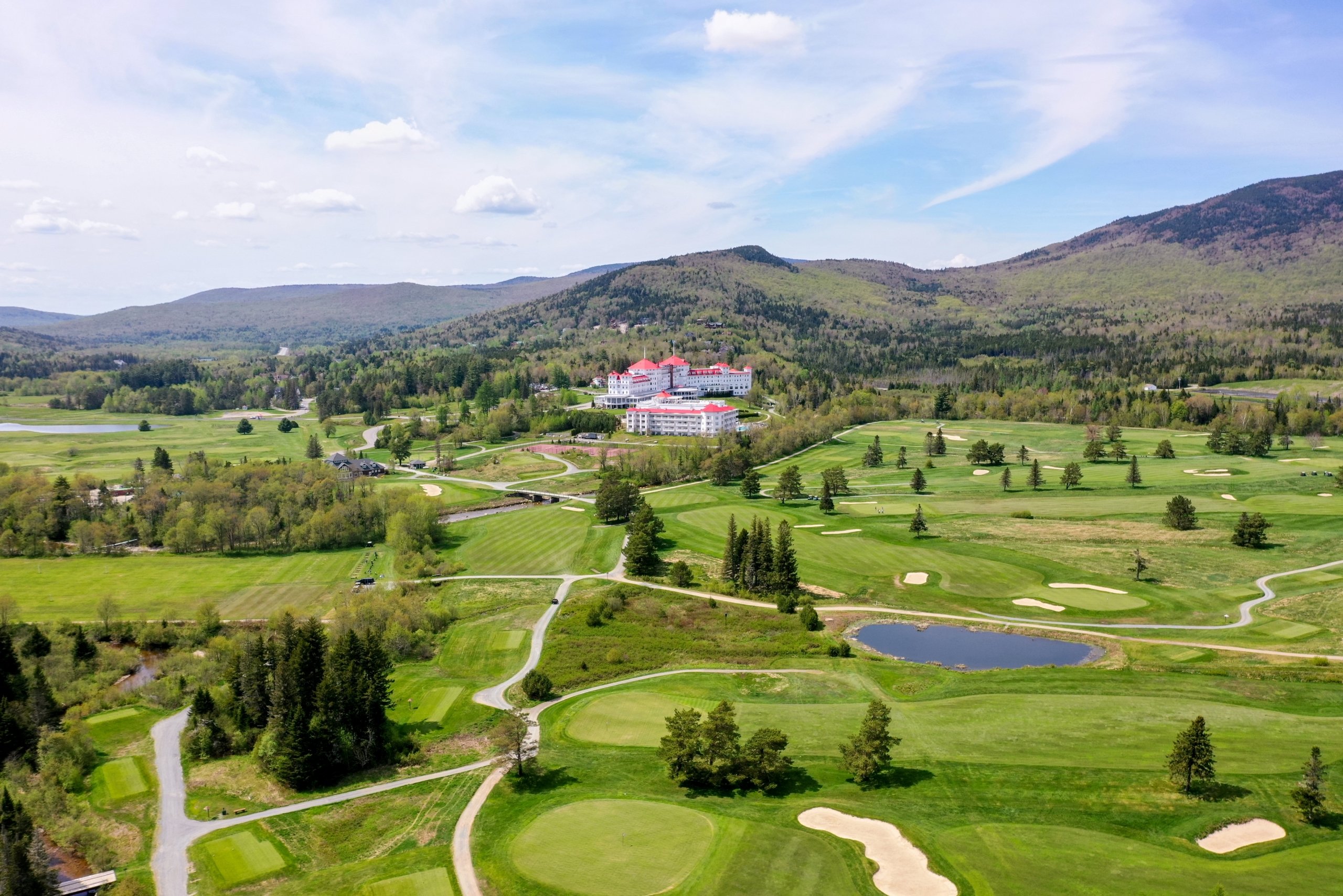 Mount Washington Resort and Spa sits nestled in a forest of vibrant green trees and lush golf course.