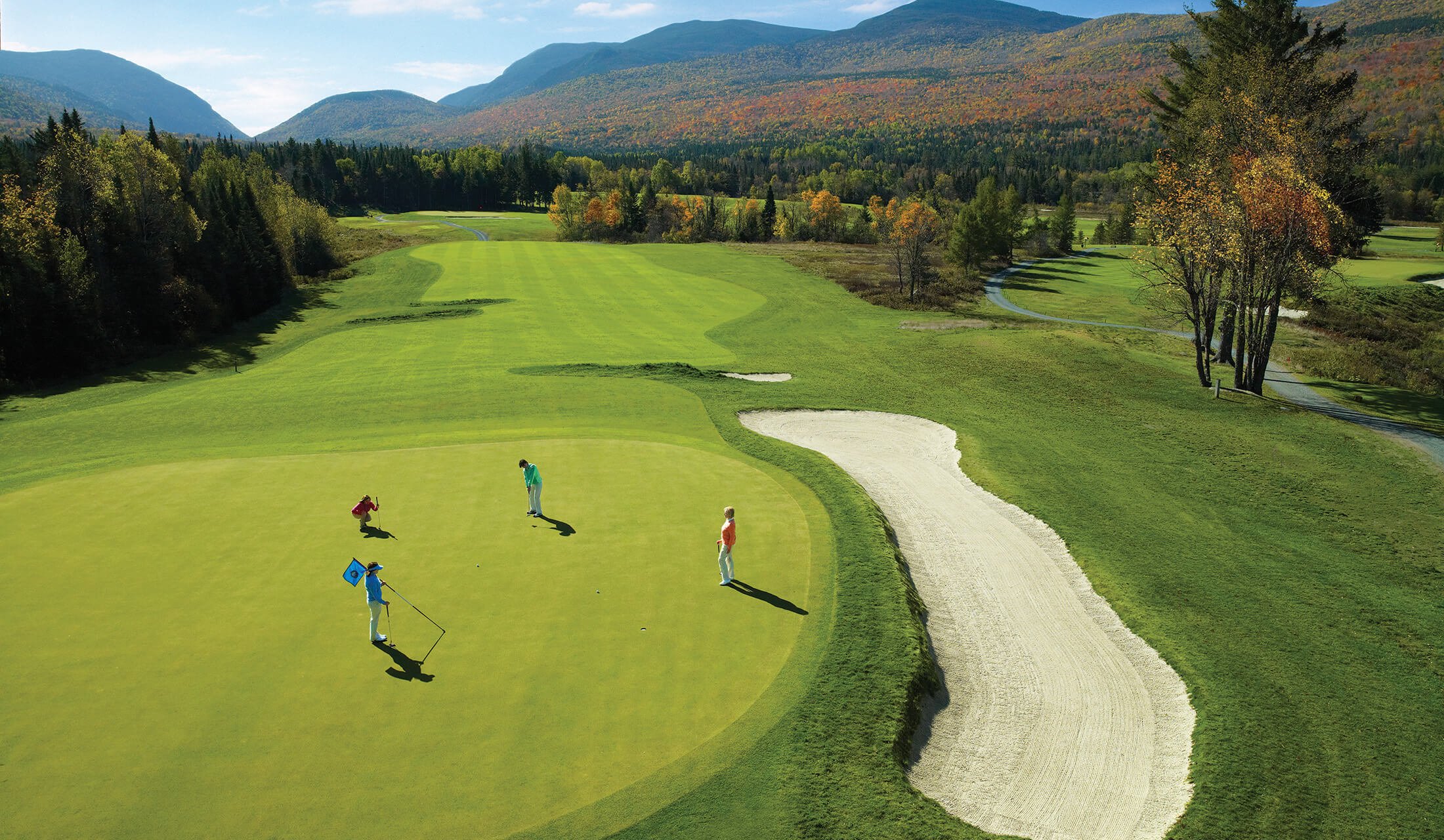 Four women put on the green at the Mount Washington Golf Course