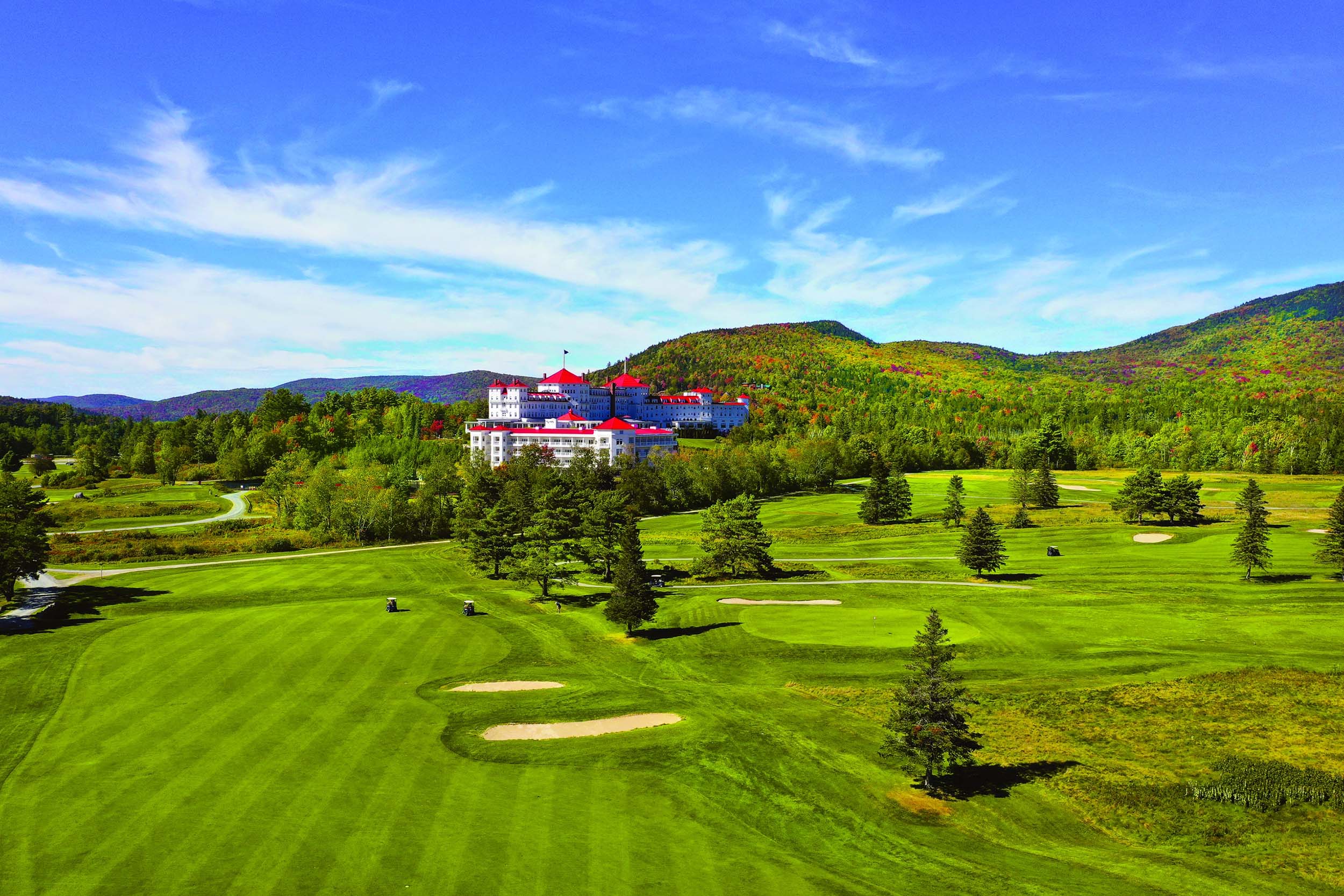 Mount Washington Resort and Spa sits nestled in a forest of vibrant green trees and lush golf course.