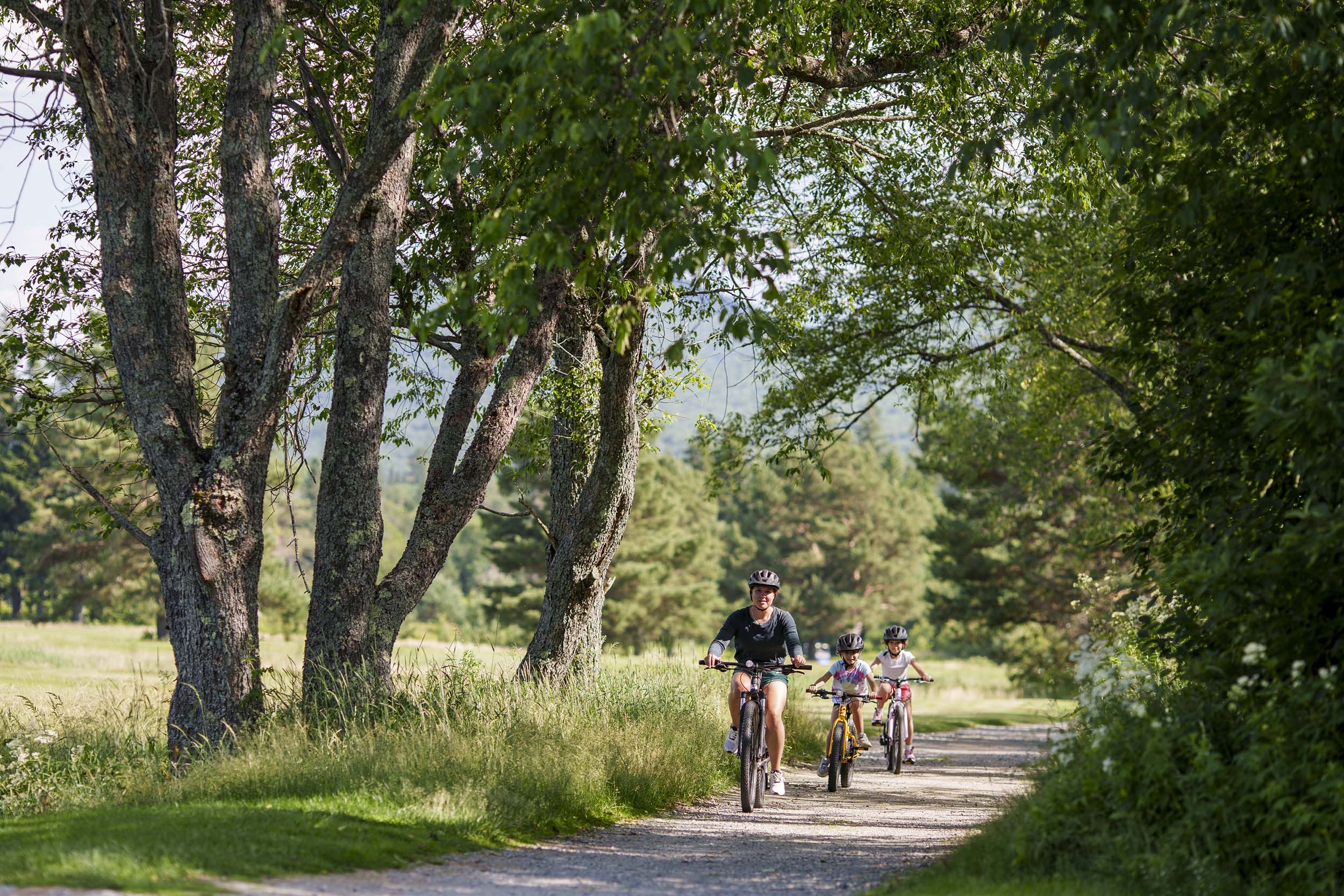 A family bike along a trail at Bretton Woods