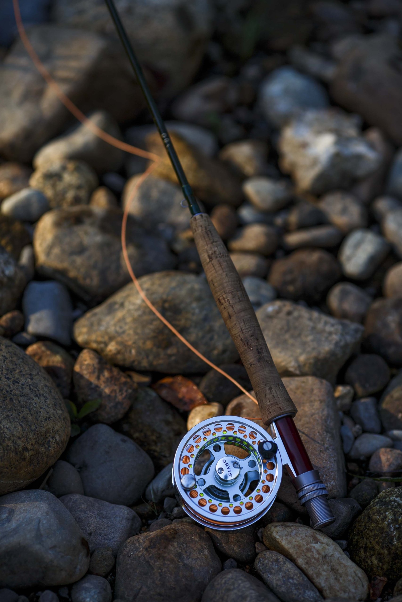 A reel sits upon the rocks of the river at Bretton Woods