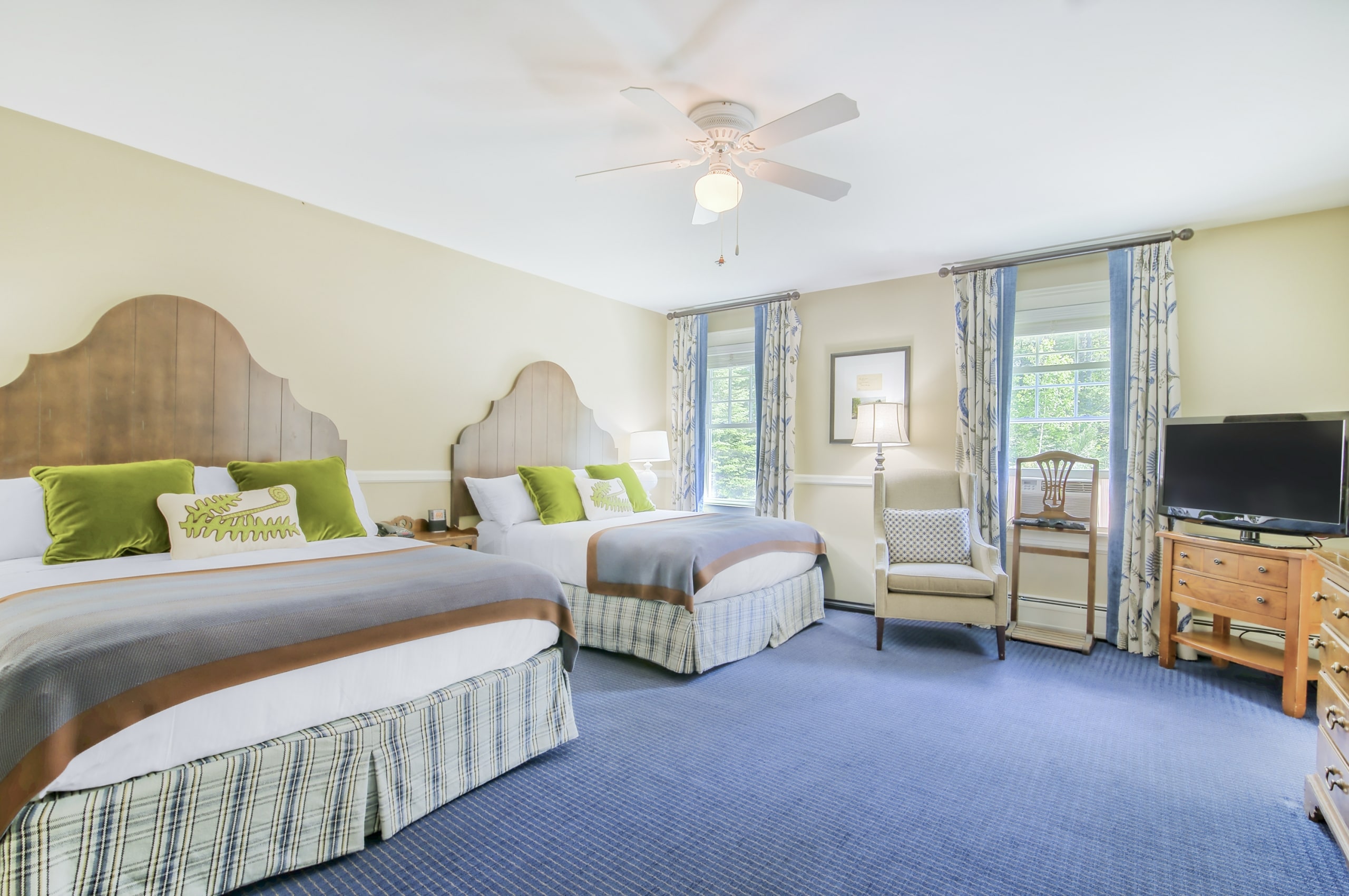 An elegant hotel room at Mount Washington Resort and Spa featuring a plush bed and stylish decor.