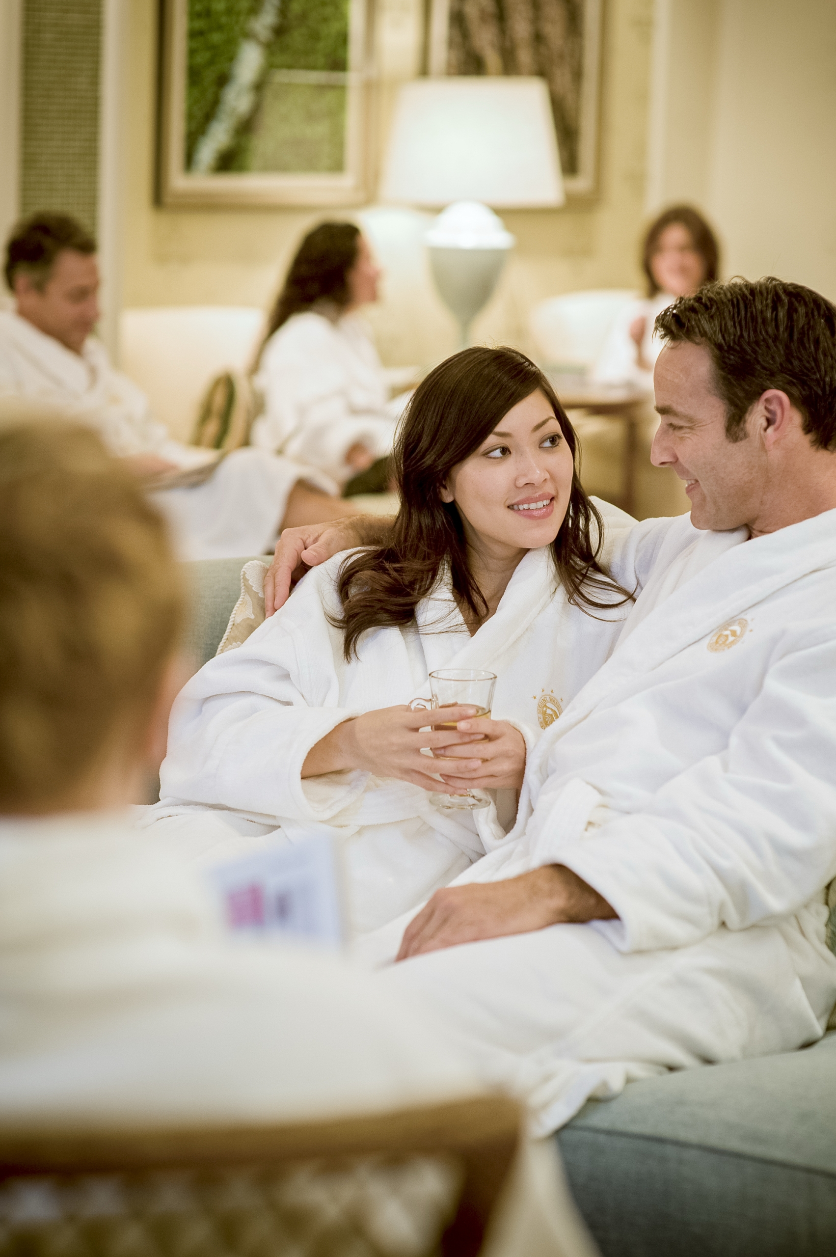 A man and woman relax in their bath robes at Mount Washington Resort and Spa.