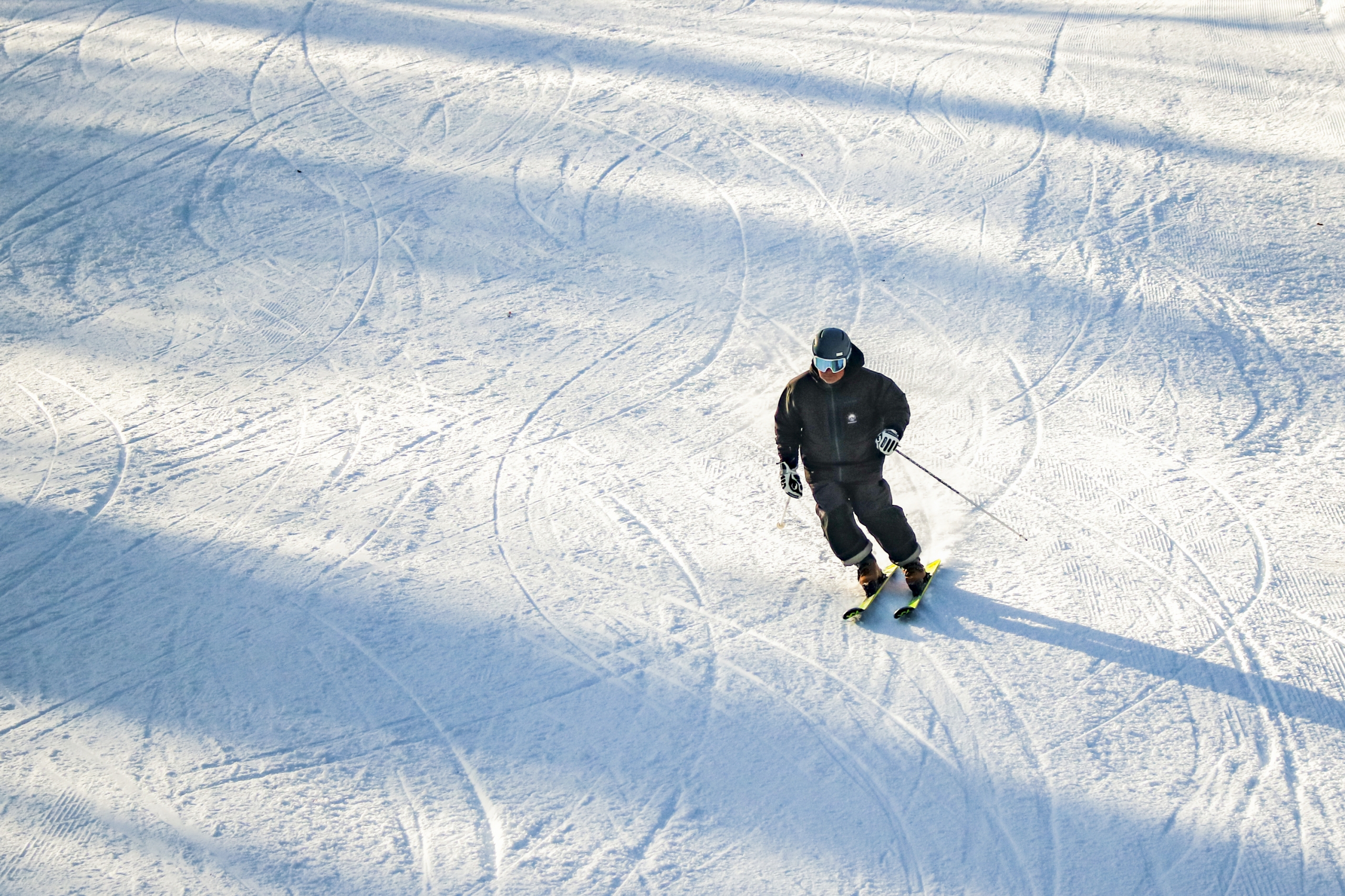 A skier descends a groomed trail at Bretton Woods.