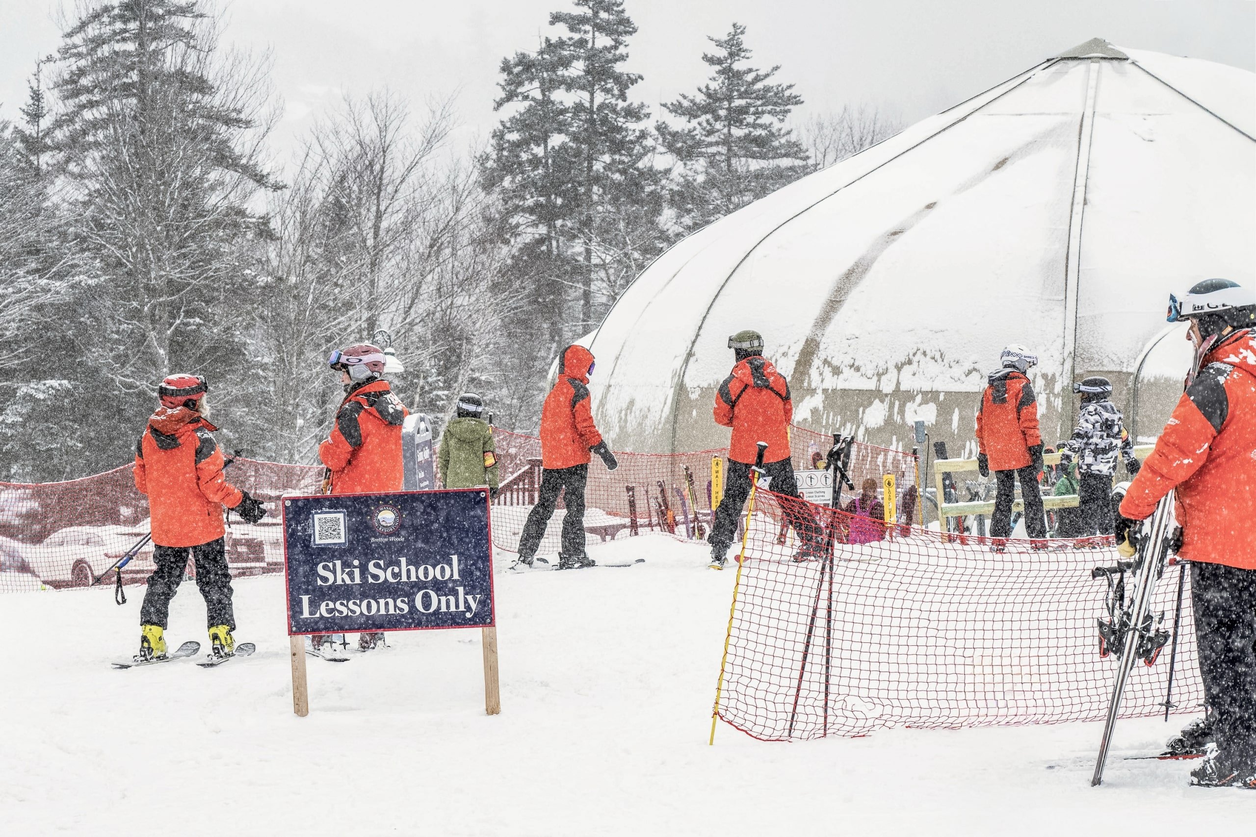 A team of ski instructors running ski school lessons at Bretton Woods.