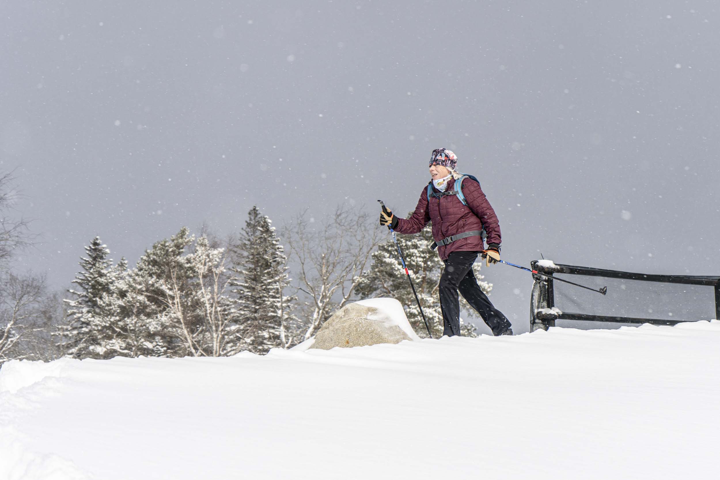 A solo Nordic skier moves in snowfall at Bretton Woods.