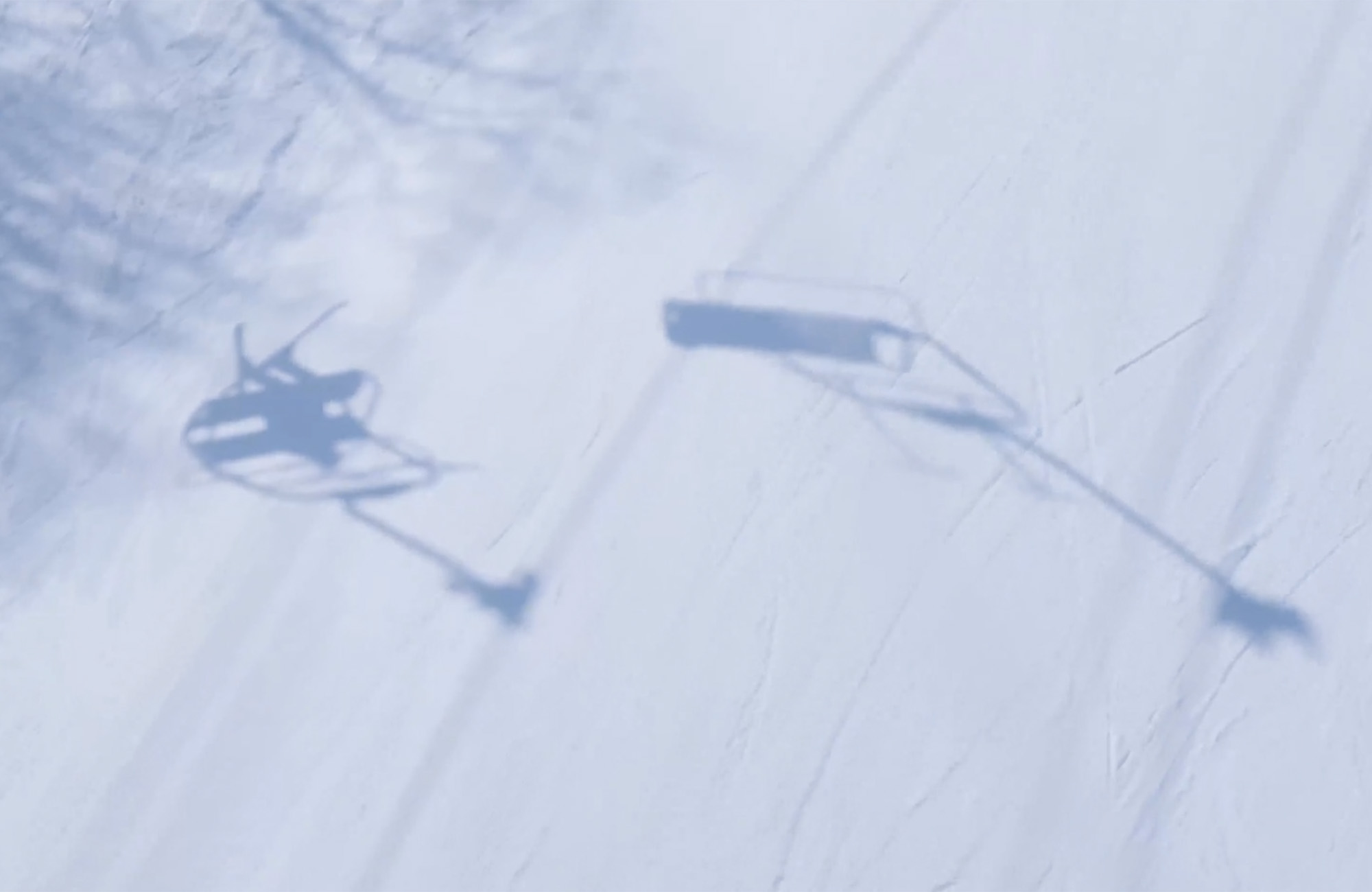 Shadows of skiers on the Bethlehem Quad chairlift.