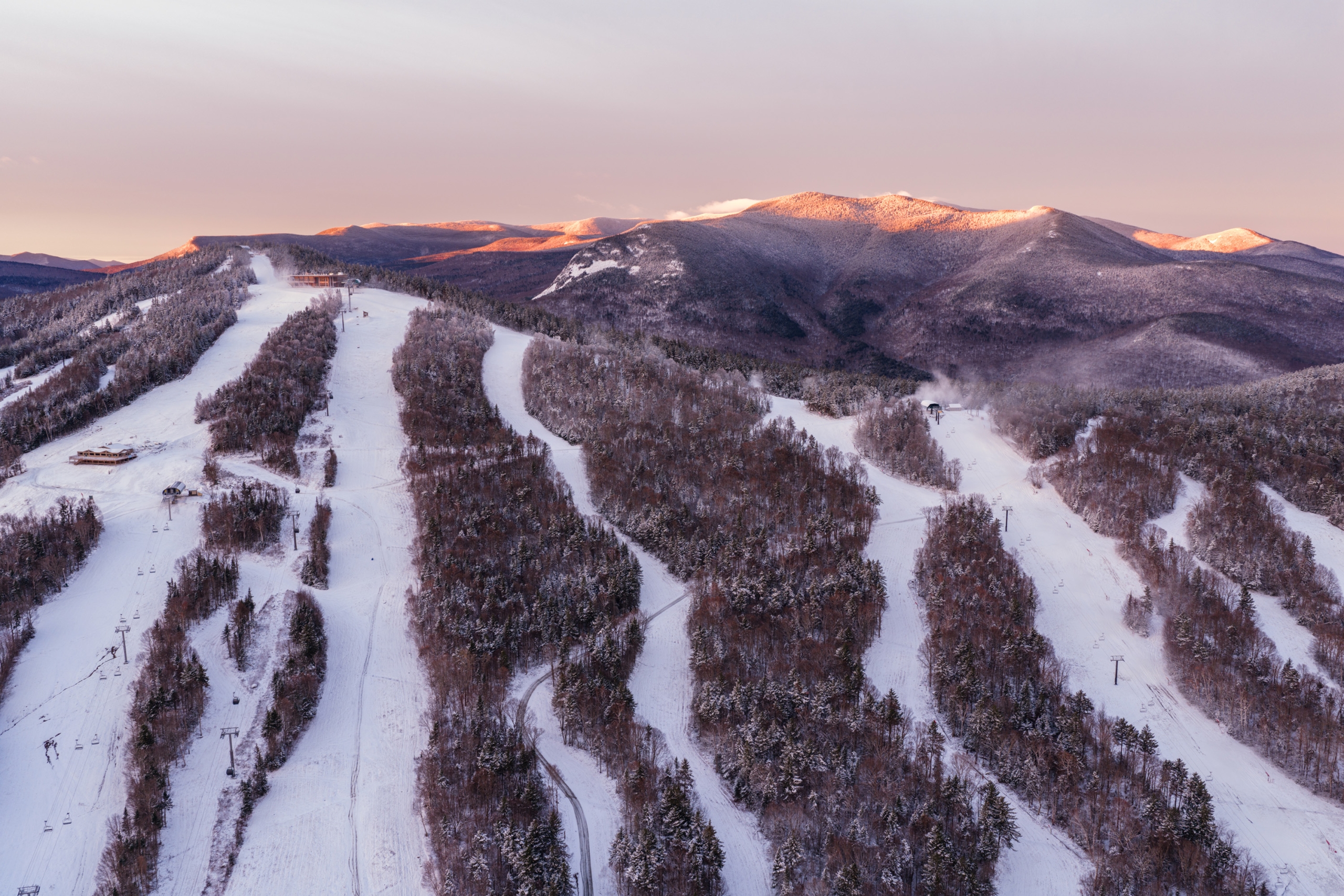 Drone over Bretton Woods at sunrise showing snowmaking operations.