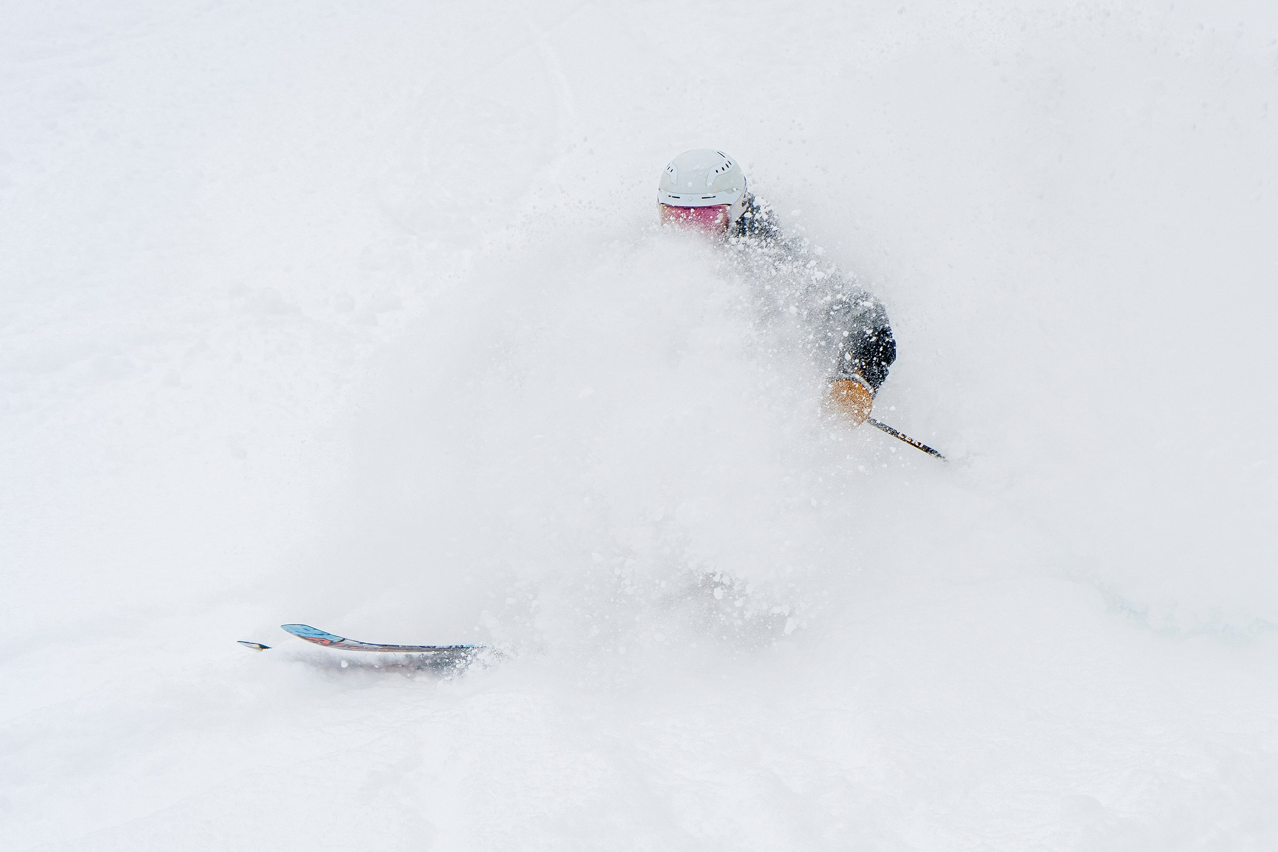 Skier being surrounded by powder snow at Bretton Woods.