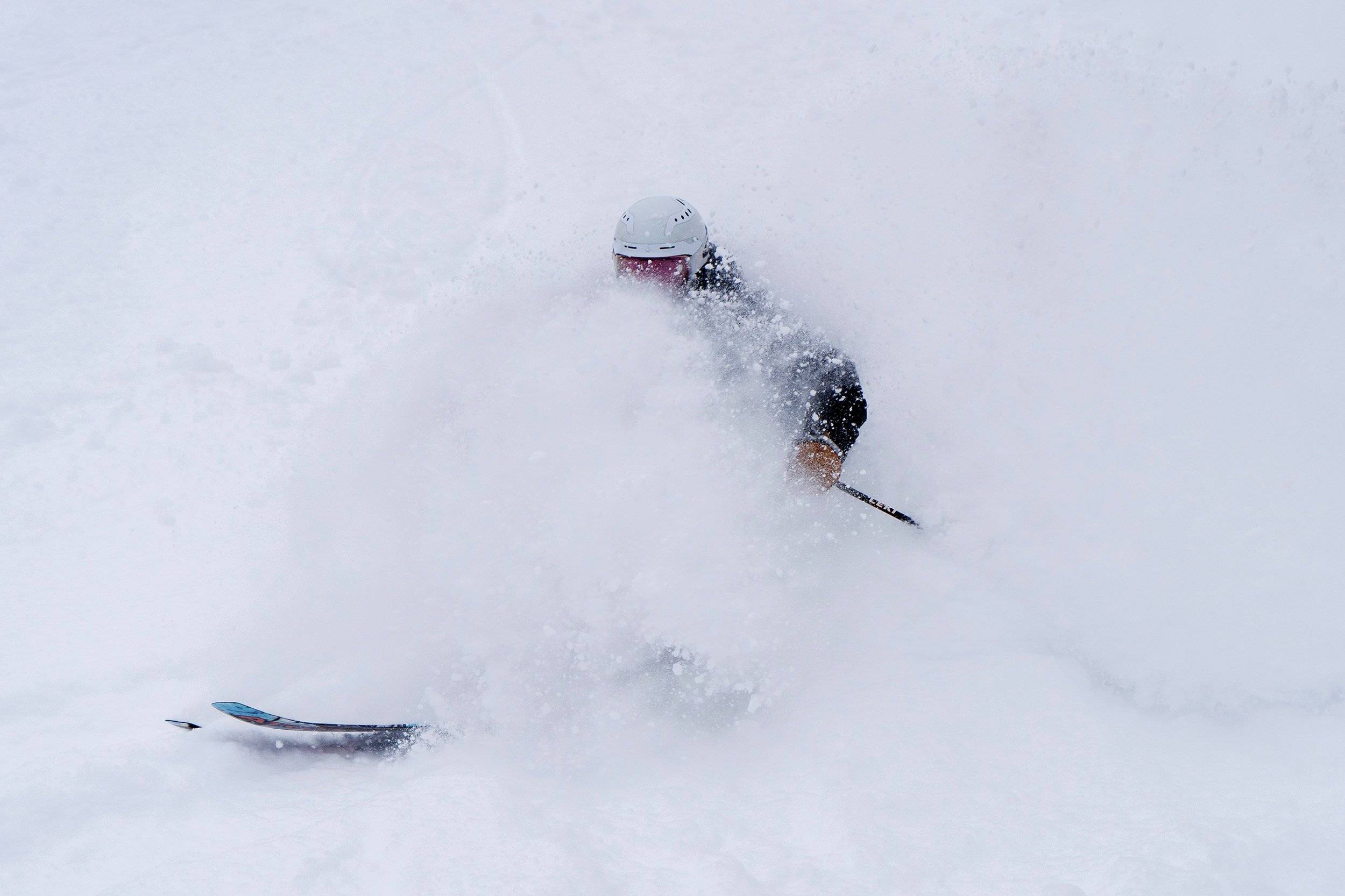 Skier being surrounded by powder snow at Bretton Woods.